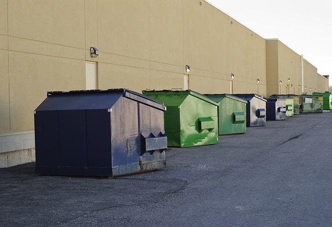 an assortment of sturdy and reliable waste containers near a construction area in Reading